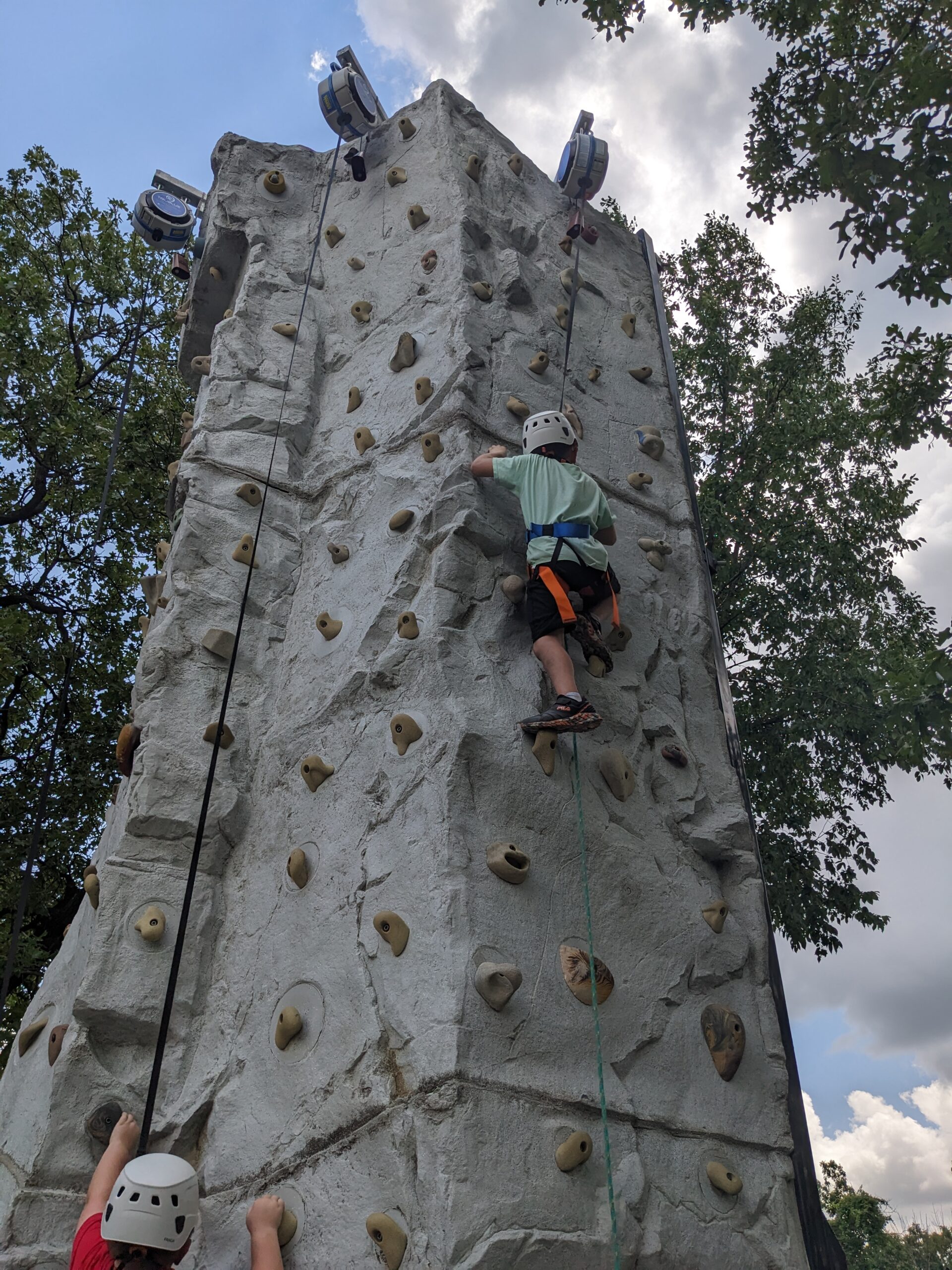 Cub Scouts climbing a climbing wall